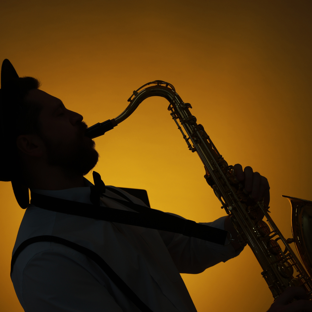 A man plays a saxophone as seen in US Music Capital Cities